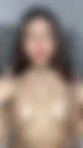 Teen plays with her pussy while sucking lollipop