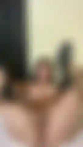 Naked in my bed… wearing heels and with a look that says it all.💋