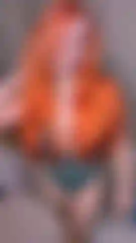 naughty redhead bends over her desk for you