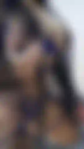 Riding a large dildo from the front.