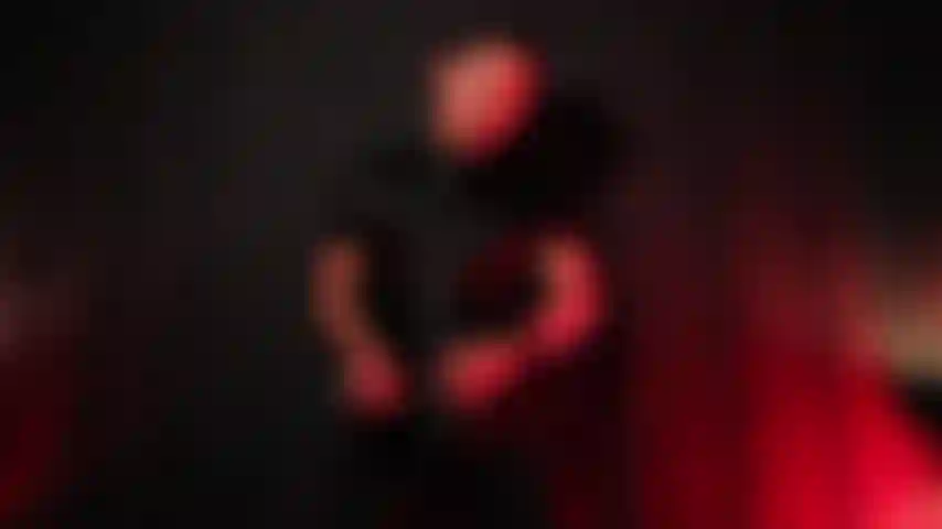 Jerking off in leather suit.