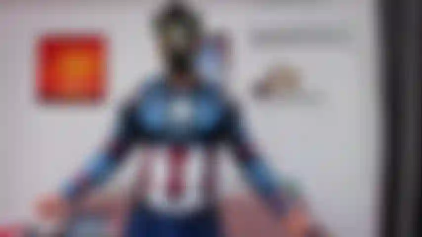 Domination in my Captain America shirt, with a gas mask