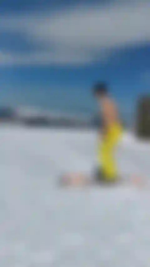 Trying to ski at the top of the mountain.