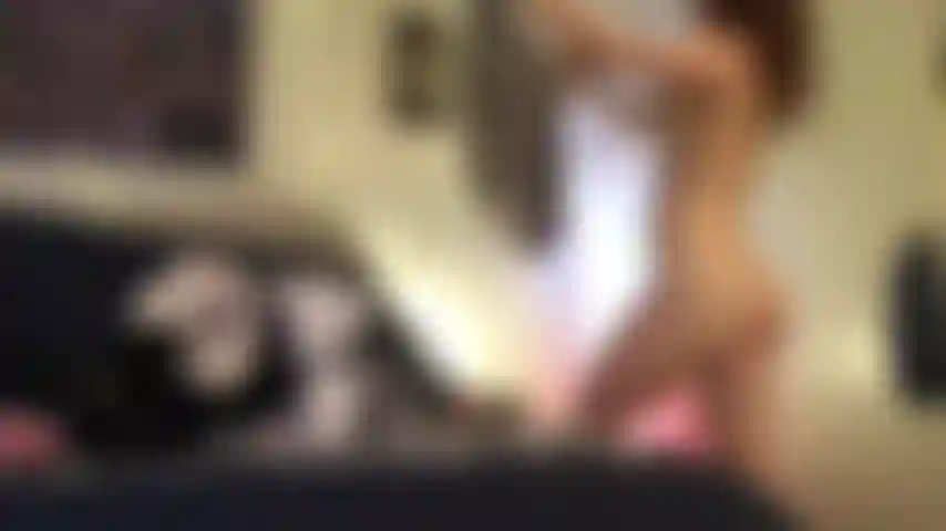Folding clothes naked.