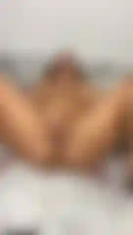 Rubbing my pussy while playing with my dildo.