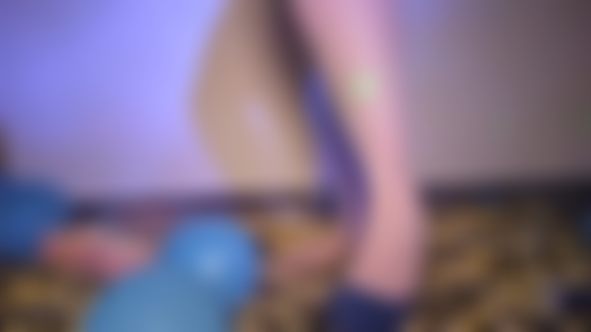Popping balloons while wearing high heels!