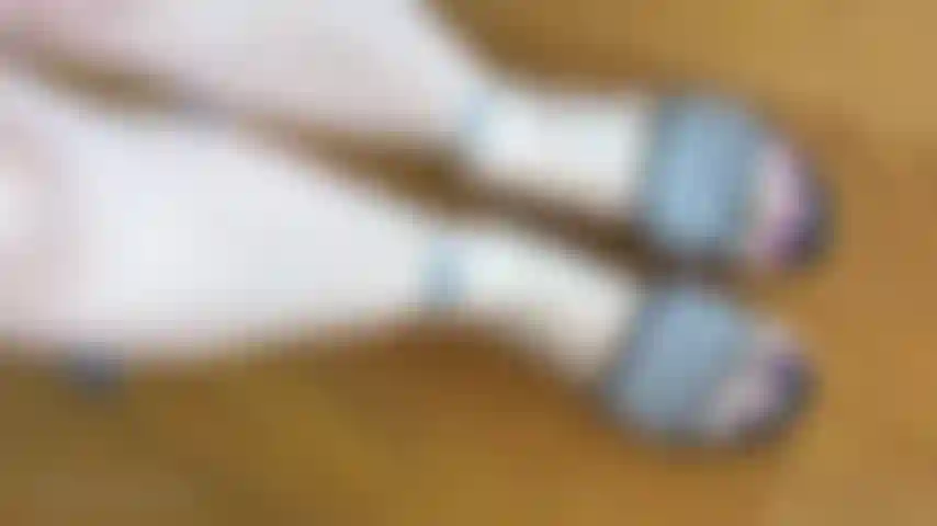 Housewife feet in slides around house