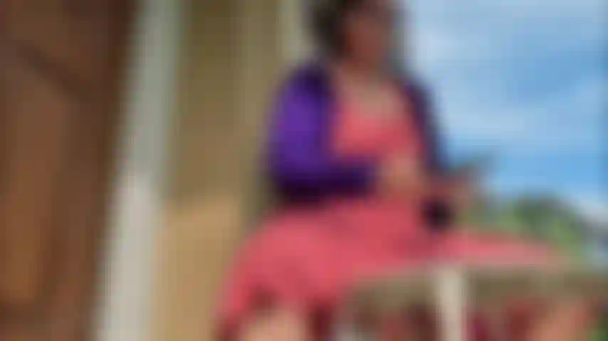 red dress stoop red toes brazil flip flops dangle