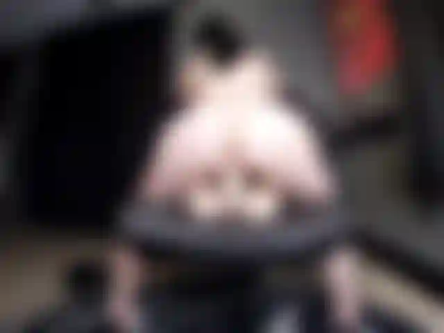 Riding on office chair.