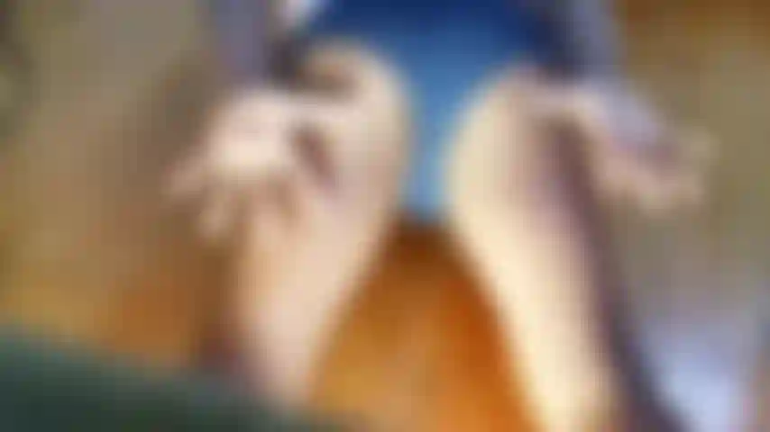 Striptease undies into navy suit slacks.