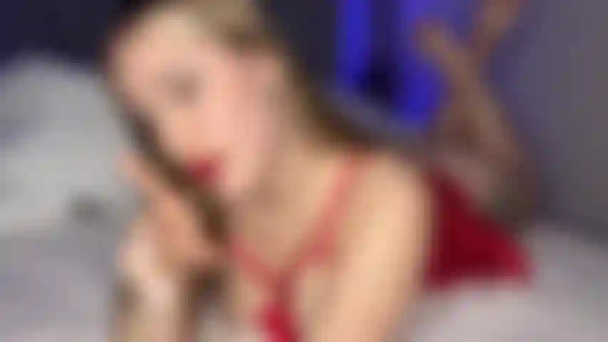 Santa's helper teases with her tongue and red lips