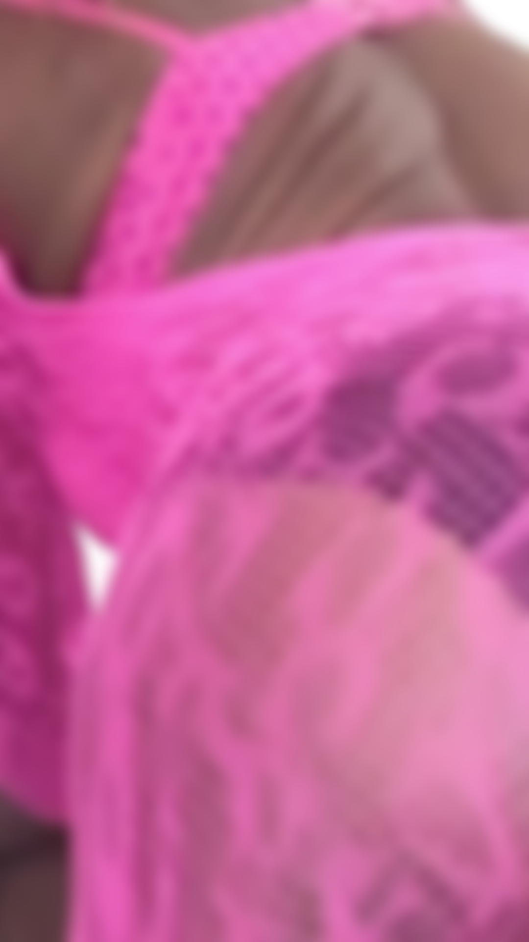 Short ass tease in pink lingerie.