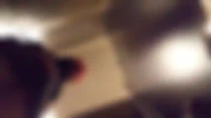 Horny sex kitten prances, flirts and diddles herself in a public restaurant.