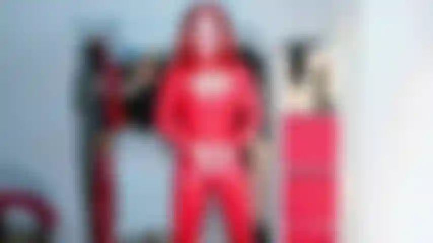 Red latex catsuit tease