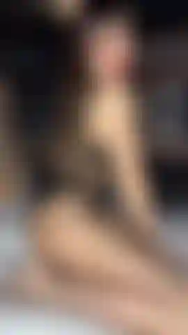 Fishnet tights body tease with nothing underneath & red lips.