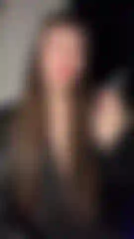 Goddess emily smoking in leather & lace with red lips.