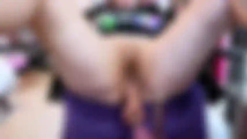 I sit on the chair, legs spread wide over the arms, pussy exposed. I position the fuckmachine so the huge dildo is aimed at my hole. I turn it on low, moaning as it thrusts deep inside me again and again. I grip the chair, body shaking, tits bouncing hard while the machine fucks my pussy faster and deeper