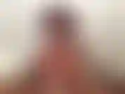 (65) GoldieStar in this slideshow Photo Set wears Pink Corset Bodysuit and plays with her hairy pussy.