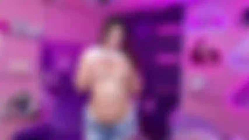 Young girl undressing plays with her breasts