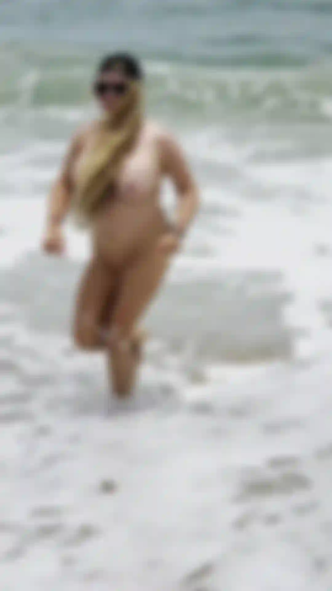 Running on the nude beach. Watch my titties bounce in the sun!