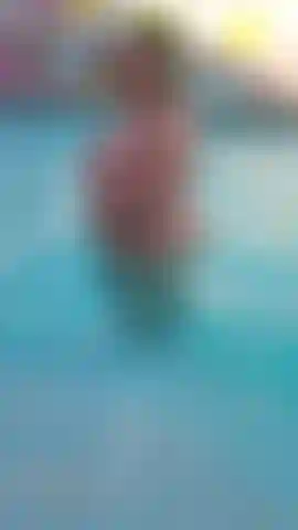 Ass Worship Femdom pool splashing video, watch the Mistress naked in the pool, talking dirty,  shaking her ass,  bouncing her ass, and splashing you.