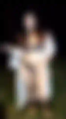 Sock in mouth, in the forest.