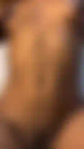 girl covers her body with oil while playing with her hairy pussy in her living room