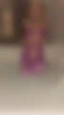 Purple one piece and a jacuzzi