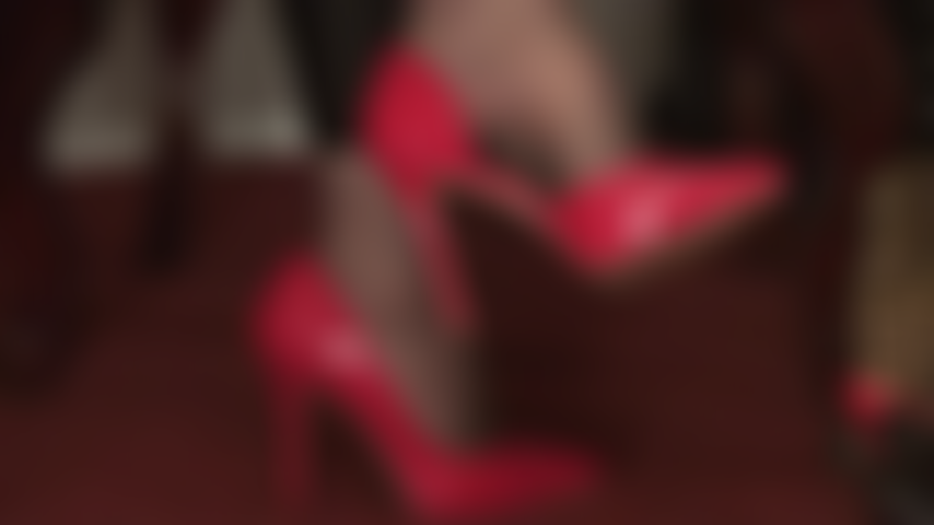 The power of red heels - mistress vivian is playing with your submissive mind, her wonderfully arched pantyhose feet in elegant red low cut pumps.