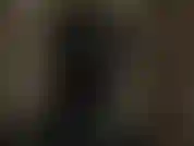 Kinky latex hooded mistress teases your cock and your nipples while she is wearing a black shiny latex mask.