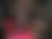 Sexy crossed and extended legs in sheer black pantyhose and hot fetish pumps.