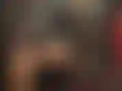 Mistress clad in black rubber - tall shiny boots paired with a sexy black glossy latex outfit.