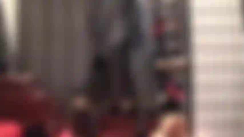 Leather clad goddess tempts with her perfect ass adorned with a long black leather coat.