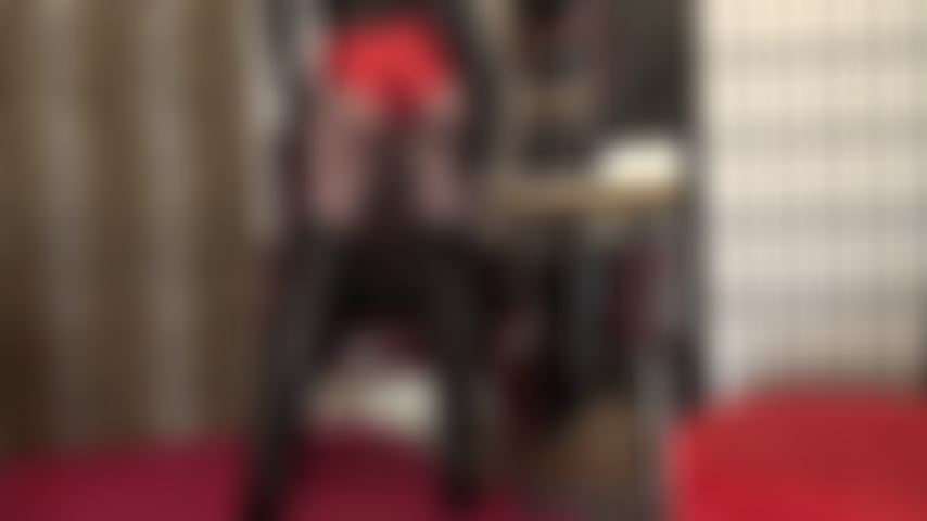 Mistress has you drooling over this fantastic outfit of metallic red hot shorts, black pantyhose and long leather boots.
