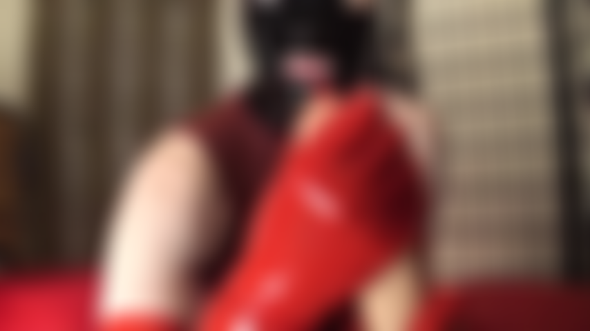 Slippery squirting dildo fun in latex outfit with rubber hood and gloves.