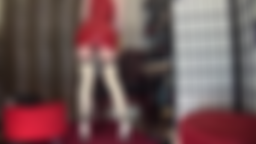 Worship in sexy short red rubber dress and seamed latex stockings - Mistress Vivian teases with upskirt views and tasty latex gloves.