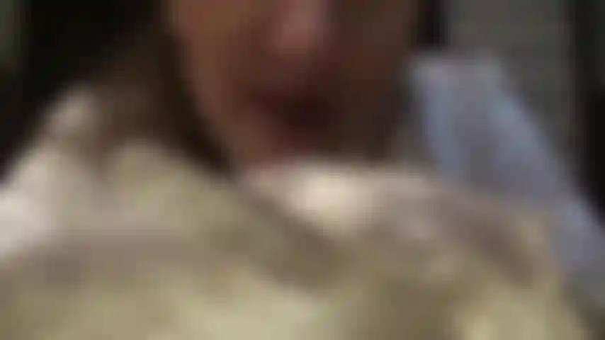 Ivory colored satin gloves and brown fully fashioned garter stockings on nude pantyhose.