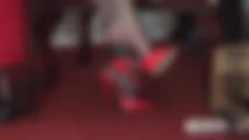 Red stiletto mules tease your slave cock.