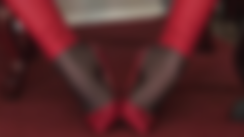 Admire Mistress Vivian's incredible arches in red leather pumps and black nylons.