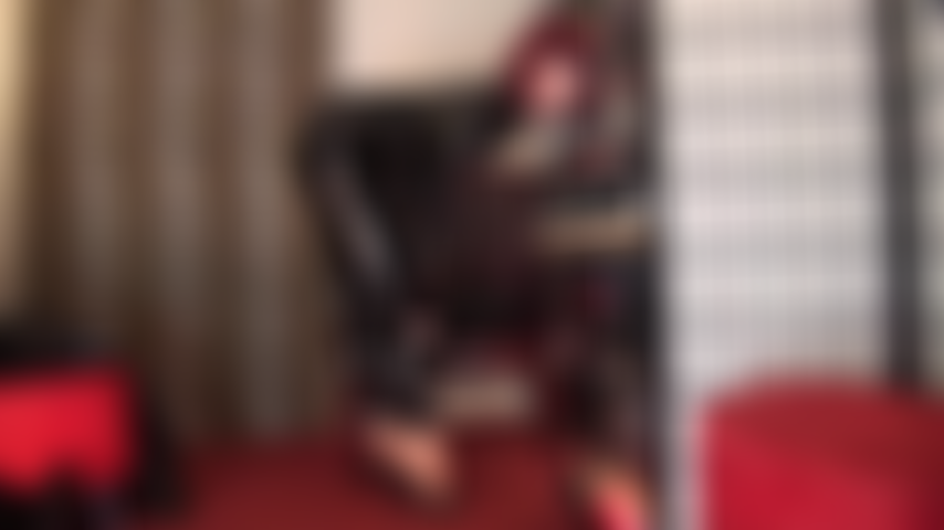 Shiny black PVC Catsuit and sexy high heeled mules - Your Goddess teases with her incredibly high foot arches in heels and pantyhose and grants sneaky peeks to what's underneath the suit.