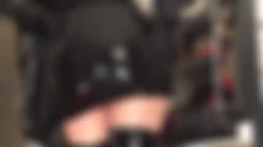 Admire mistress' amazing ass in shiny tight black rubber mini.