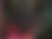 Latex mistress in tight black rubber outfit and sexy stiletto boots.