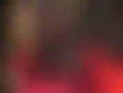 Hot black seamed fishnet tights over black pantyhose, paired with black knee high leather boots.