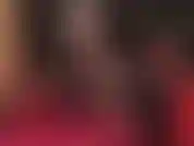 Mistress vivian, the dangling queen, performing sexy shoe play with a shiny red platform pump and black nylons.