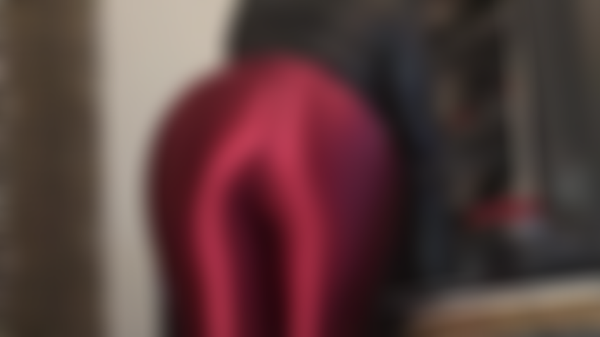 Ass worship in shiny dark red satin pants - Mistress Vivian's round ass filling out these high gloss disco pants perfectly.