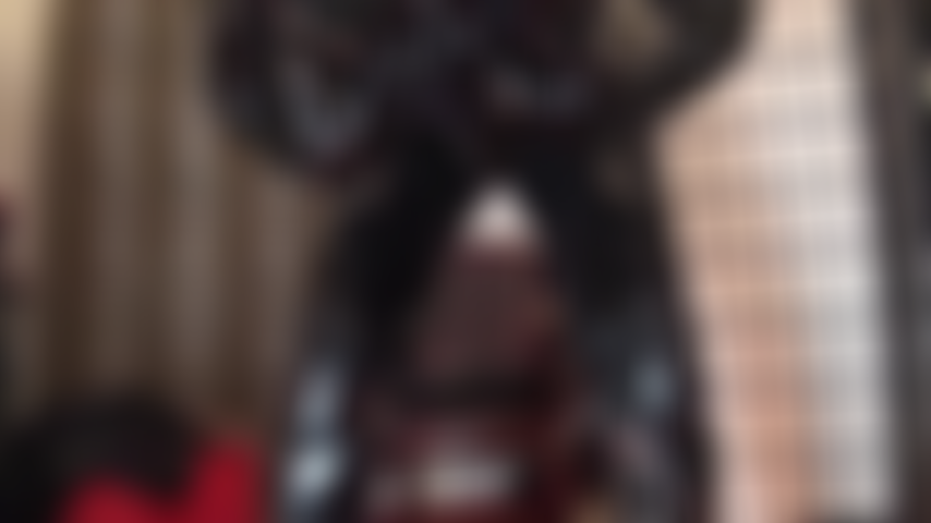 Shiny PVC perfection - Mistress teases in a curve hugging black pvc catsuit, boots and gloves.