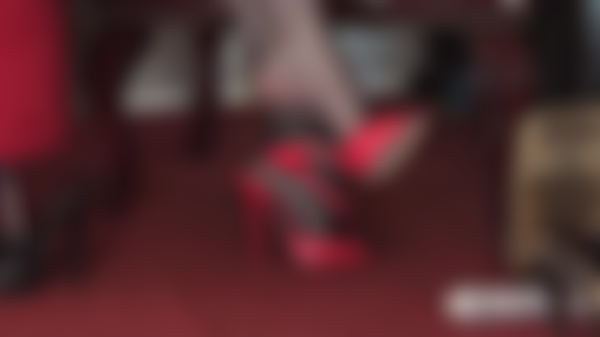 Red stiletto mules tease your slave cock.