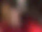 Seductive tease in nude seamed nylon stockings and garters.