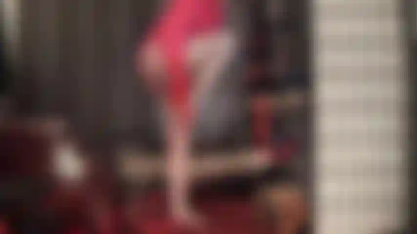 Adore mistress' sexy curves in shades of red and coral - a pretty ruffled satin blouse, red gloves, girdle panties, pantyhose and stocking layers make you weak.