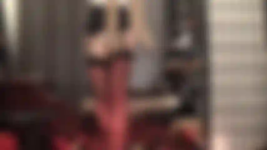 A shiny pantyhose layer over stockings and garter girdle for the ultimate nylon tease.